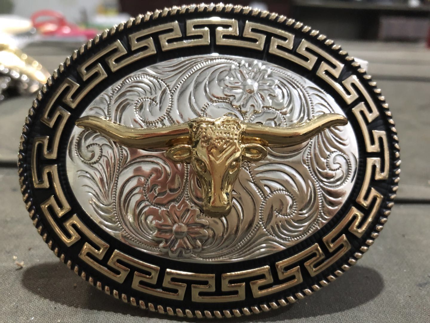 Silver and gold color with bull head, star ect conchos western buckle